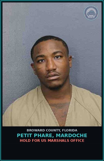 CCW arrest card for PETIT PHARE, MARDOCHE in Broward County: HOLD FOR US MARSHALS OFFICE