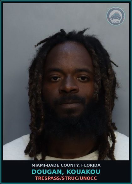 CCW arrest card for DOUGAN, KOUAKOU in Miami-Dade County: TRESPASS/STRUC/UNOCC