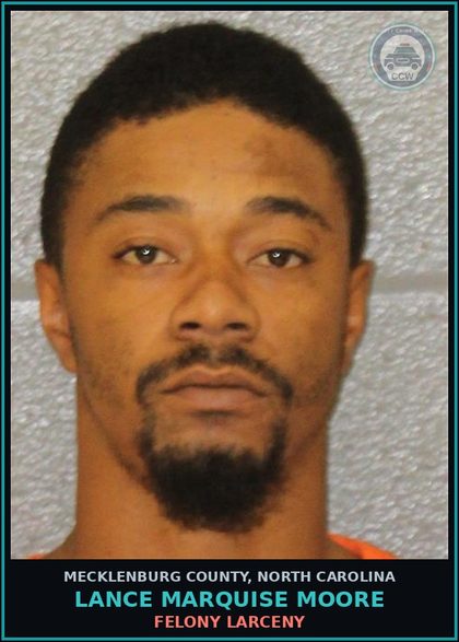 CCW arrest card for LANCE MARQUISE MOORE in Mecklenburg County: FELONY LARCENY