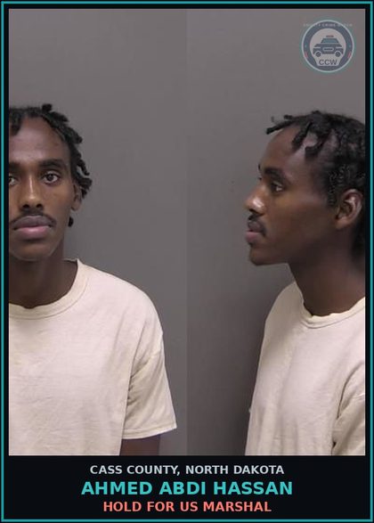 CCW arrest card for Ahmed Abdi Hassan in Cass County: HOLD FOR US MARSHAL