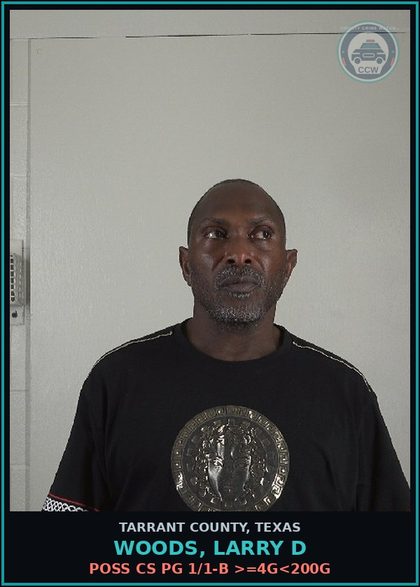 CCW arrest card for Woods, Larry D in Tarrant County: MAN DEL CS PG 1 >=4G<200G