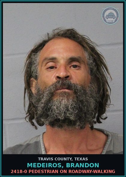 CCW arrest card for Medeiros, Brandon in Travis County: 2418-0 PEDESTRIAN ON ROADWAY-WALKING