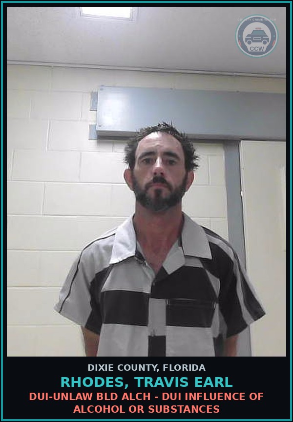 Booking mugshot of RHODES, TRAVIS EARL in Dixie County