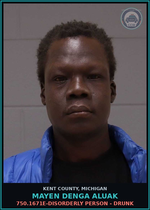Booking mugshot of Mayen Denga Aluak in Kent County