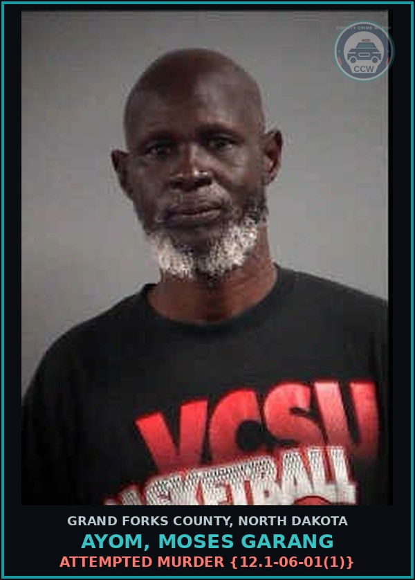 Booking mugshot of Ayom, Moses Garang in Grand Forks County