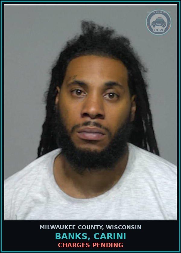 Booking mugshot of Banks, Carini in Milwaukee County